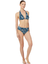 Model wears teal and white abstract wave print string halter top with midrise bikini bottom
