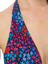 Close up shot of floral bikini top with halter neck tie, adjustable cups, and a spaghetti tie under the bust