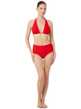 Model wearing a cherry red bikini top with halter neck tie, adjustable cups, and a spaghetti tie under the bust with matching high waist bikini bottoms 
