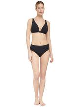 Model wearing a black plunge neckline, classic bikini top with adjustable straps and an elastic underband with a matching classic midrise bikini bottom